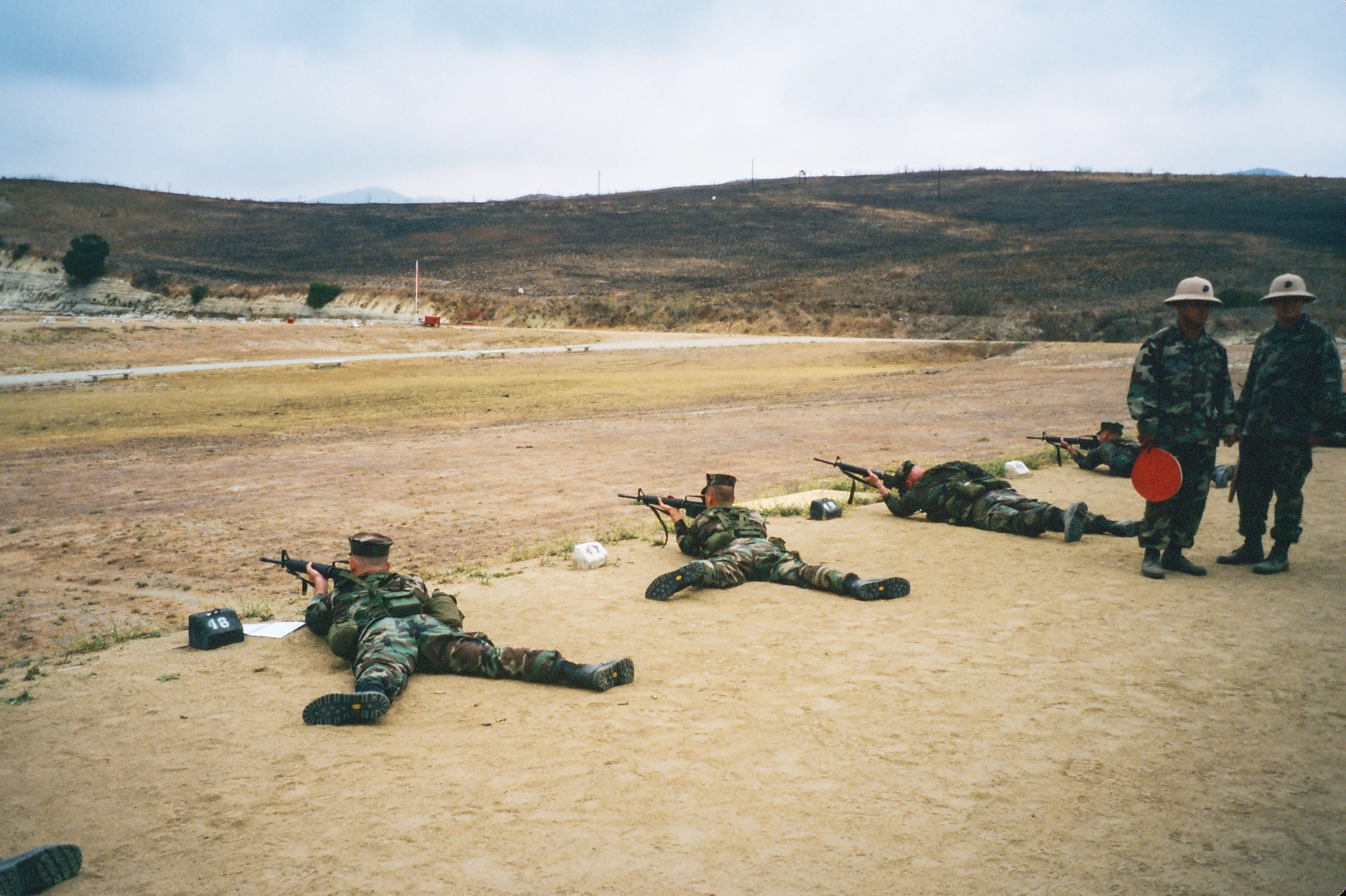 Qualification day at Edson Range, Camp Pendleton. Until the recent adoption of Trijicon’s ACOG scope all Marines shot out to 500 yards with aperture sights.